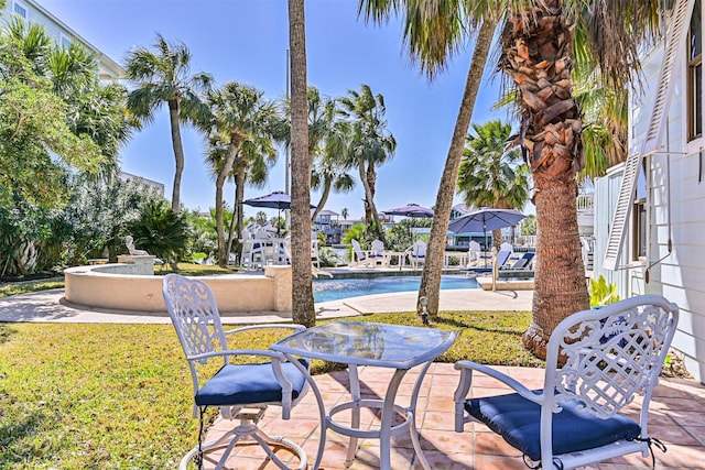 view of patio with an outdoor pool