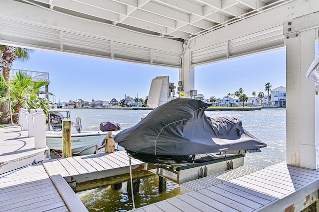 view of dock with a water view and boat lift