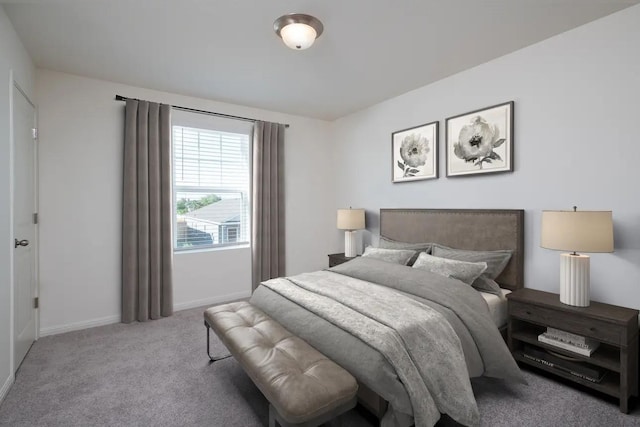 bedroom featuring carpet flooring and baseboards