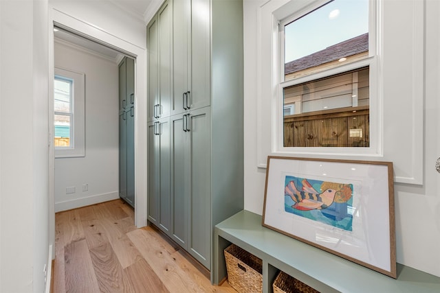 203 Munford St, Houston, TX 77008 - mudroom featuring light wood-style flooring, baseboards, and ornamental molding