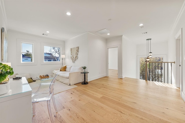 203 Munford St, Houston, TX 77008 - sitting room featuring crown molding, plenty of natural light, and wood finished floors