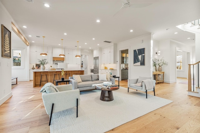 203 Munford St, Houston, TX 77008 - living area featuring ornamental molding, stairs, and light wood-style floors