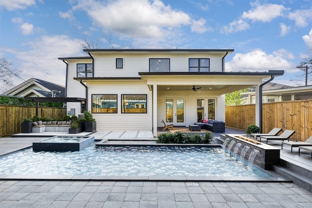 203 Munford St, Houston, TX 77008 - back of house featuring an outdoor living space with a fire pit, french doors, a fenced backyard, and a wooden deck