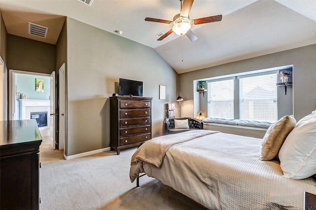 bedroom featuring visible vents, a ceiling fan, baseboards, lofted ceiling, and light colored carpet