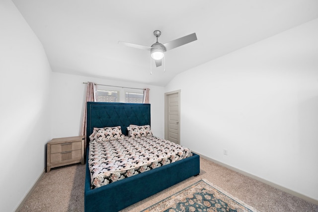 carpeted bedroom featuring lofted ceiling, ceiling fan, and baseboards