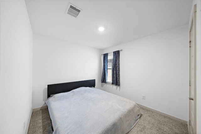 bedroom featuring carpet floors, baseboards, and visible vents