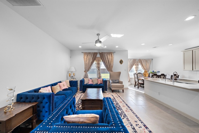 living room featuring recessed lighting, visible vents, a ceiling fan, light tile patterned flooring, and baseboards