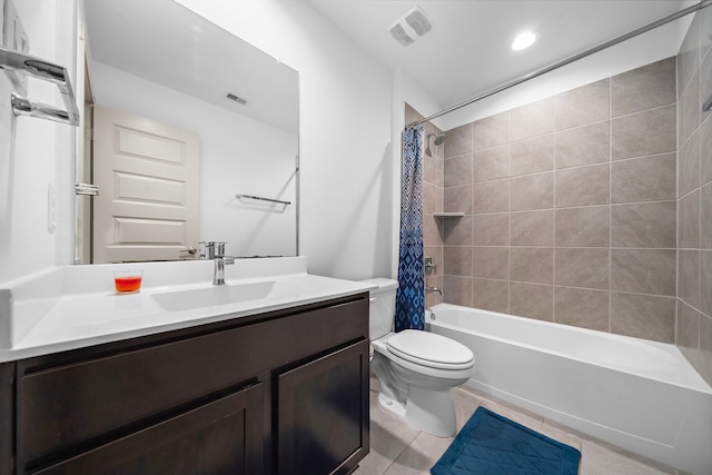 bathroom with tile patterned flooring, toilet, visible vents, vanity, and shower / tub combo with curtain