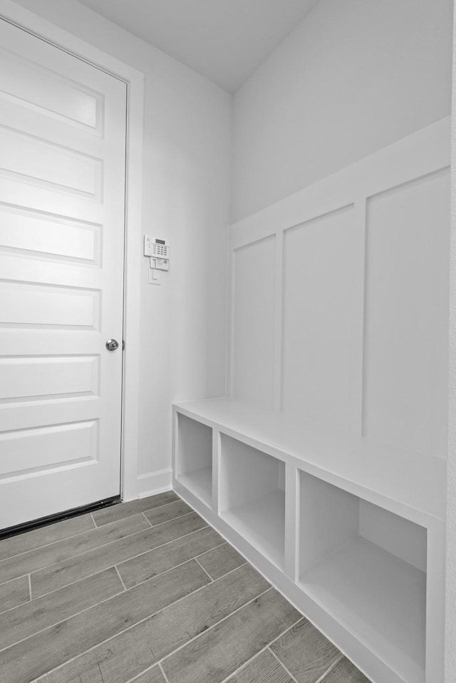 mudroom with wood finish floors