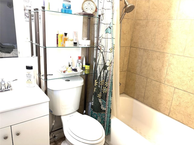 full bath with shower / bath combo, vanity, and toilet