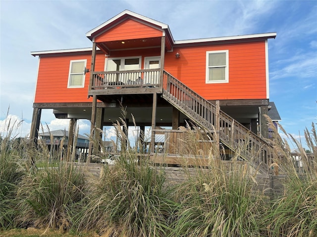 back of property with stairs