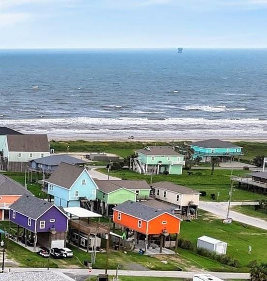 aerial view with a water view and a residential view