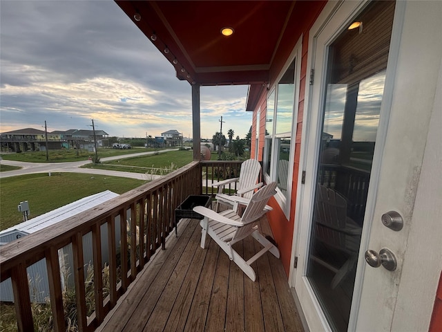 view of balcony at dusk