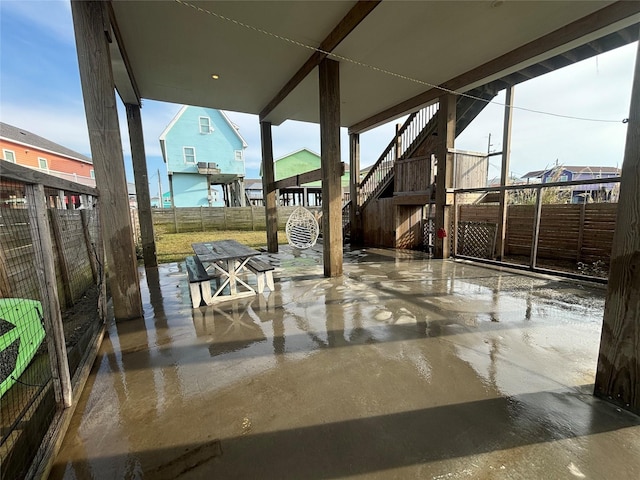 view of patio with a fenced backyard and stairs