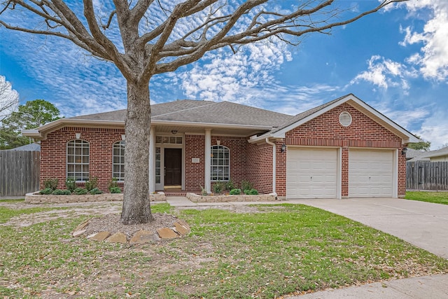 ranch-style home featuring driveway, brick siding, an attached garage, fence, and a front yard