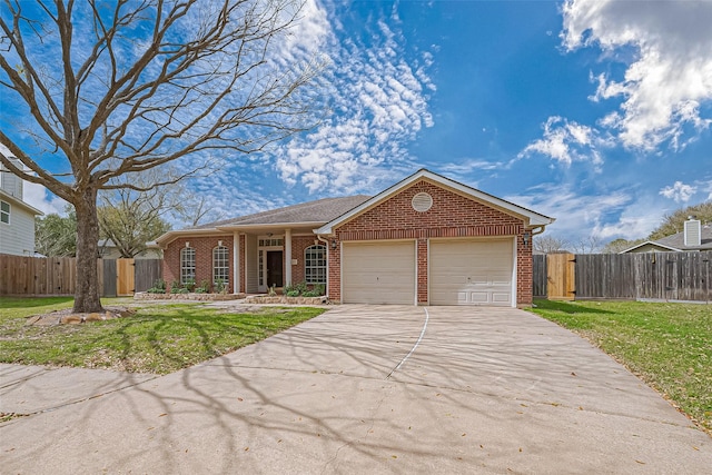 ranch-style home featuring brick siding, concrete driveway, an attached garage, a front yard, and fence