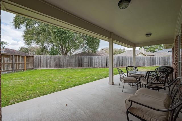 view of patio featuring outdoor dining space and a fenced backyard