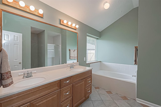 full bathroom featuring double vanity, a sink, a bath, and tile patterned floors