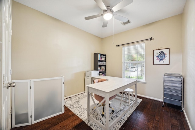 home office featuring visible vents, wood-type flooring, baseboards, and a ceiling fan