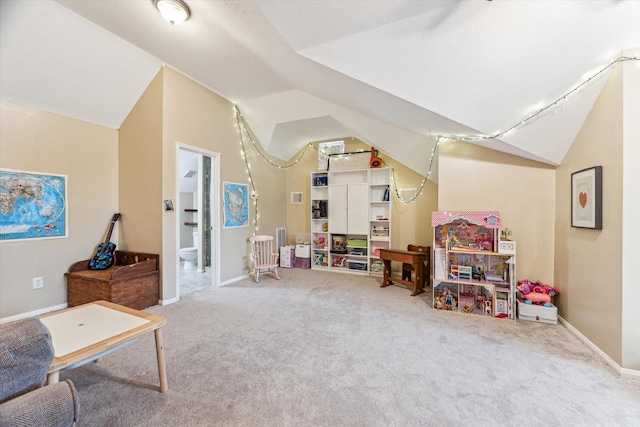 rec room featuring vaulted ceiling, carpet flooring, and baseboards