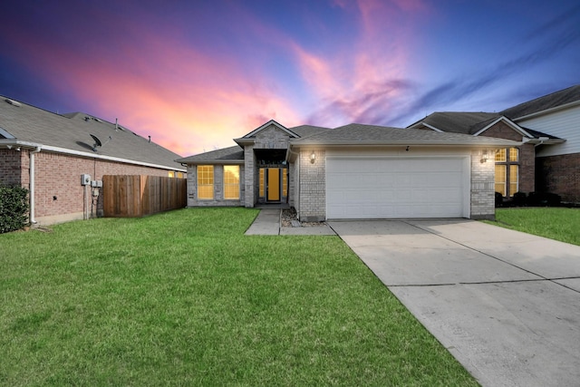 single story home featuring brick siding, fence, a garage, driveway, and a front lawn