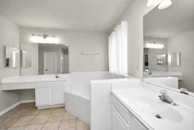 bathroom featuring two vanities, a stall shower, a sink, tile patterned flooring, and a bath