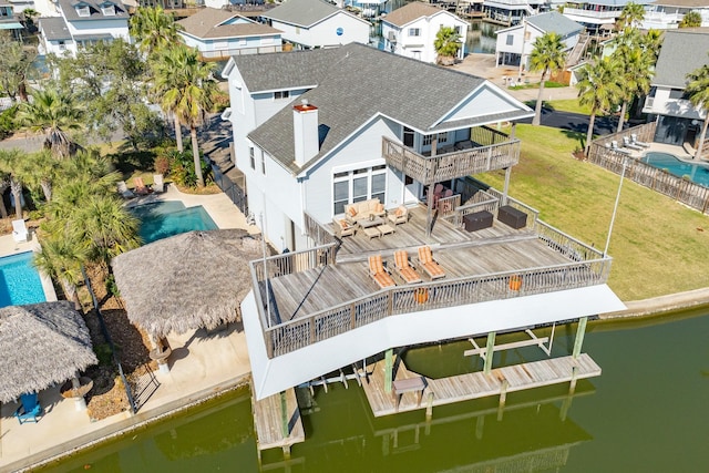 bird's eye view featuring a residential view and a water view