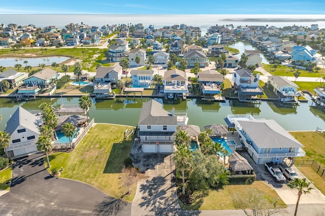 birds eye view of property with a residential view and a water view