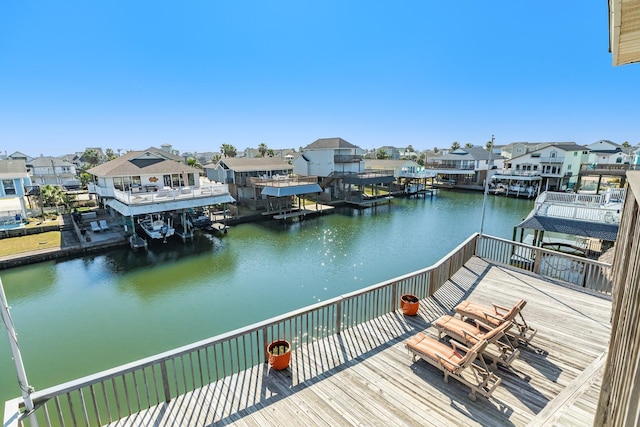 dock area with a water view and a residential view