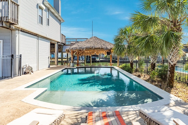 view of pool with a gazebo, fence, a fenced in pool, and a patio