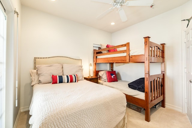 carpeted bedroom featuring baseboards, ceiling fan, and recessed lighting