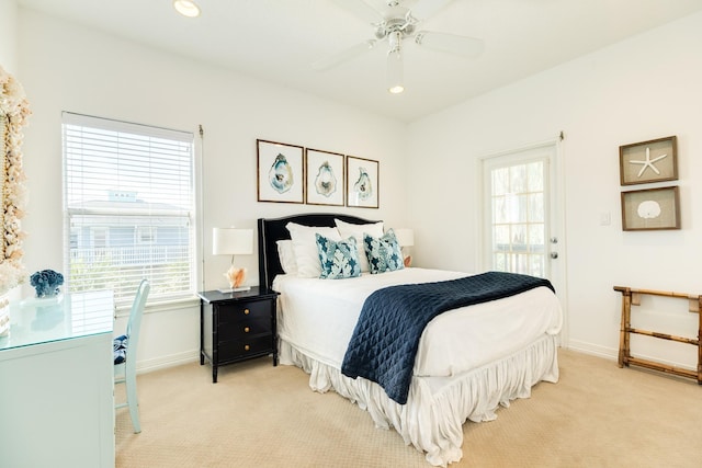 bedroom with recessed lighting, light carpet, and baseboards