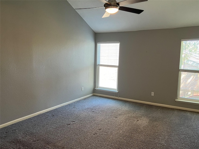 unfurnished room featuring ceiling fan, carpet floors, plenty of natural light, and baseboards