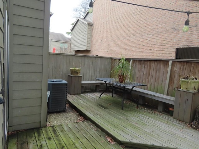 wooden terrace featuring cooling unit