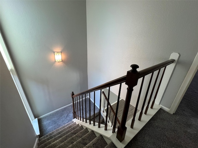 stairs with carpet and baseboards