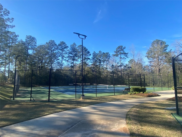 view of sport court with fence