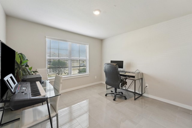 office with baseboards and light tile patterned flooring