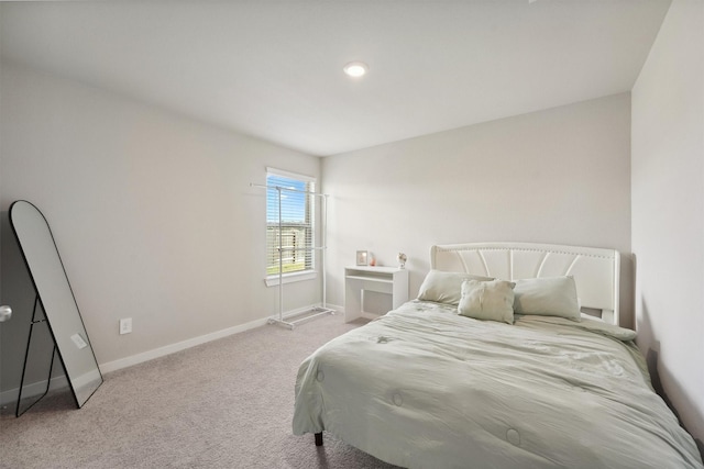 carpeted bedroom with baseboards