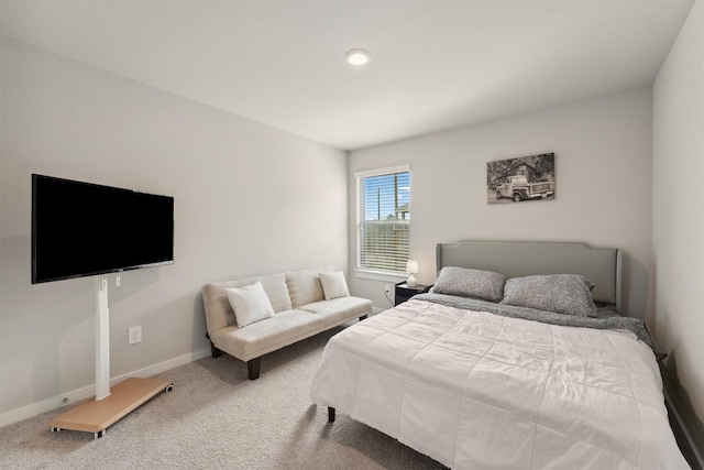 carpeted bedroom with baseboards