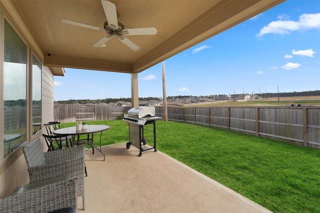 view of patio featuring a ceiling fan, a fenced backyard, and a grill