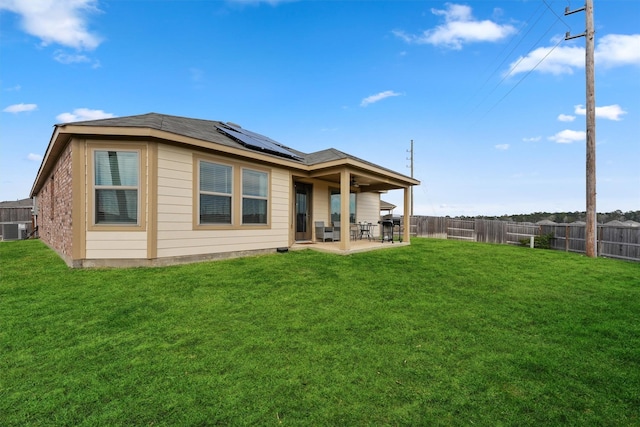 300 Flower Reed Ct, Magnolia, TX 77354 - rear view of house with a patio, solar panels, a ceiling fan, and central AC