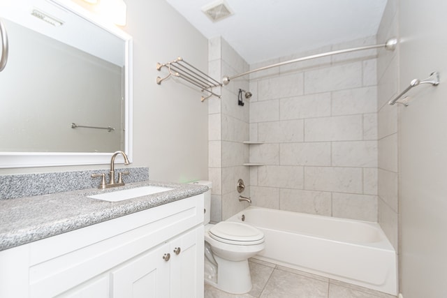 full bathroom featuring visible vents, toilet, tile patterned floors, vanity, and shower / bathing tub combination