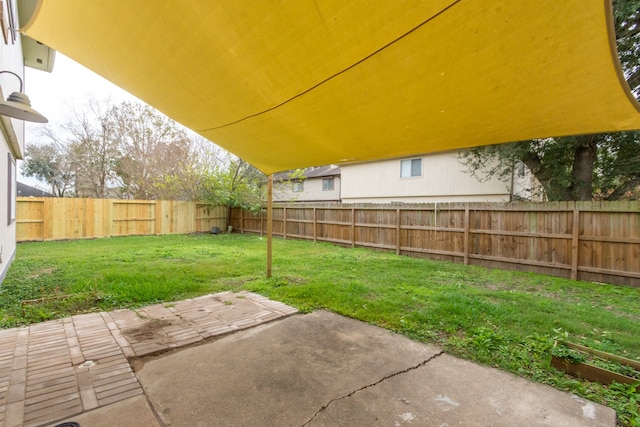 view of yard with a fenced backyard and a patio