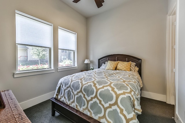 carpeted bedroom featuring ceiling fan and baseboards