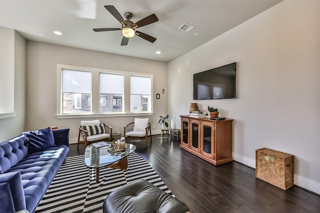 living area featuring dark wood-style floors, recessed lighting, visible vents, and baseboards