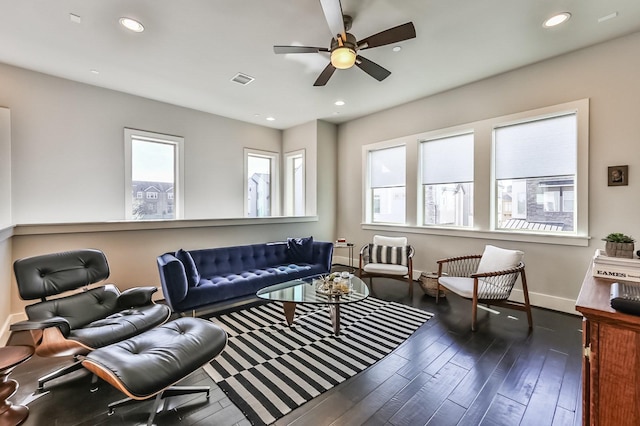 living area featuring recessed lighting, ceiling fan, baseboards, and wood finished floors