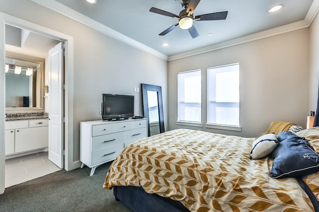 bedroom with a ceiling fan, ensuite bathroom, crown molding, dark carpet, and recessed lighting