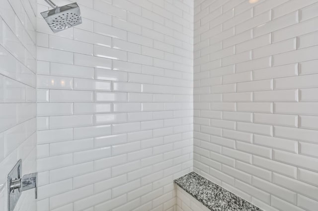 bathroom with a tile shower