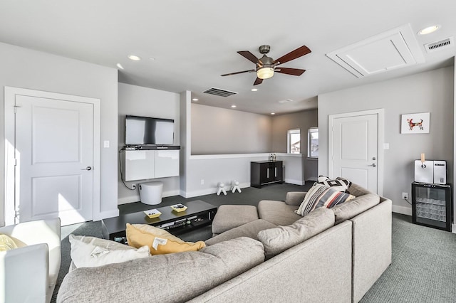 carpeted living area with baseboards, ceiling fan, visible vents, and recessed lighting