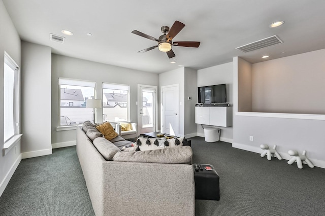 living room with carpet floors, baseboards, visible vents, and recessed lighting